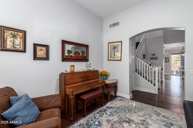 sitting room with dark wood-type flooring