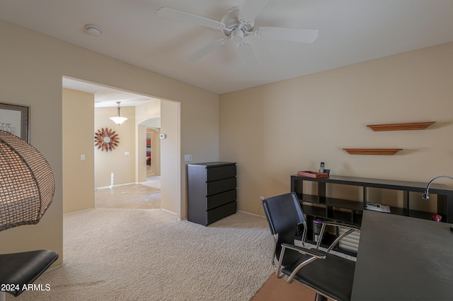 home office with ceiling fan and light carpet