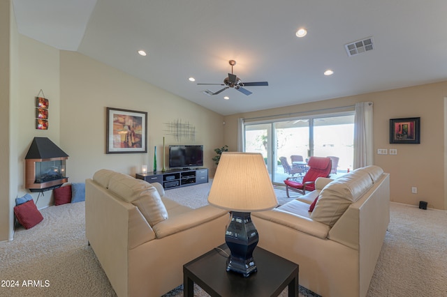 living room featuring light carpet, ceiling fan, and lofted ceiling