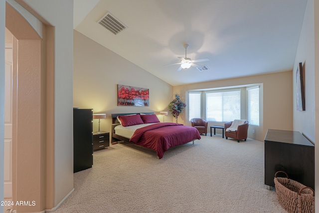 carpeted bedroom with vaulted ceiling and ceiling fan