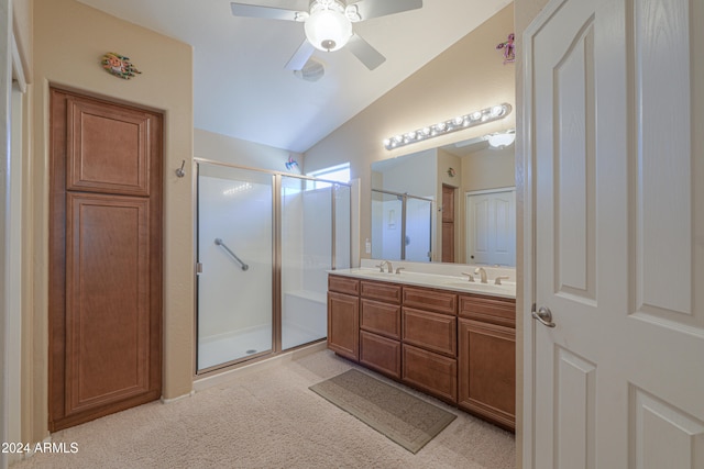 bathroom featuring vanity, a shower with door, lofted ceiling, and ceiling fan