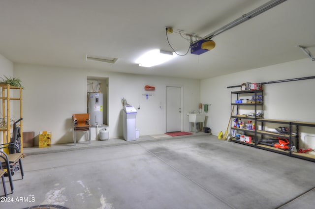 garage with sink, a garage door opener, and water heater