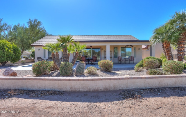 view of front of property with ceiling fan and covered porch