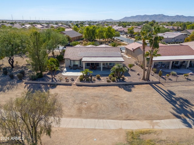 birds eye view of property featuring a mountain view