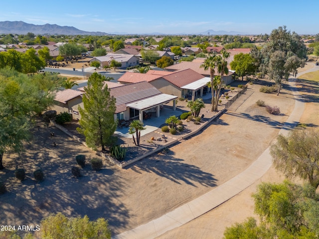 birds eye view of property with a mountain view