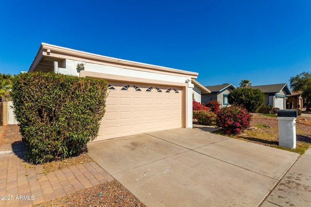 view of side of property with a garage