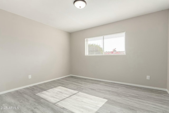 spare room with light wood-type flooring