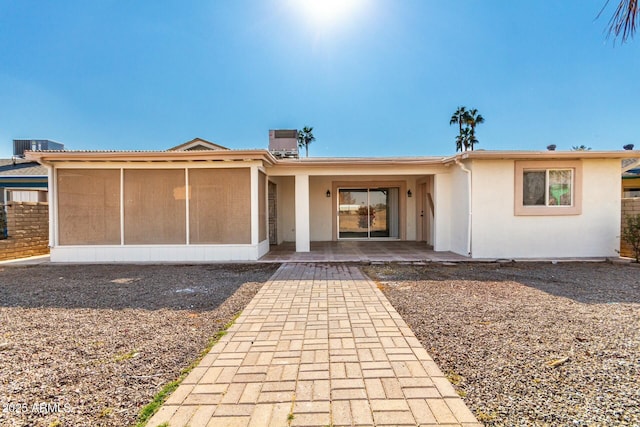 view of front of property featuring a patio area and a sunroom