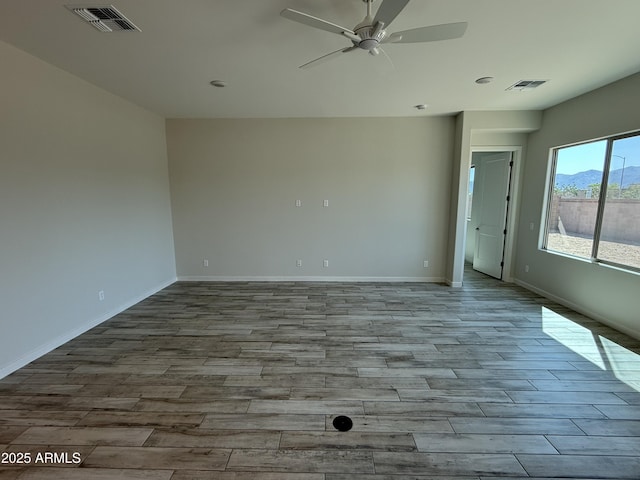17308 W Royal Palm Rd, Waddell, AZ 85355 - unfurnished room with wood finished floors and ceiling fan