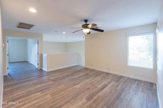 231 N Nash Way, Chandler, AZ 85225 - unfurnished room featuring light wood-style flooring, visible vents, baseboards, ceiling fan, and recessed lighting