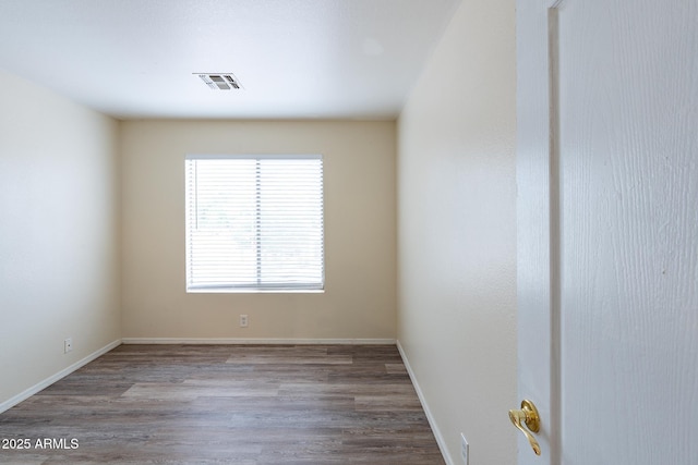 231 N Nash Way, Chandler, AZ 85225 - spare room featuring visible vents, wood finished floors, and baseboards