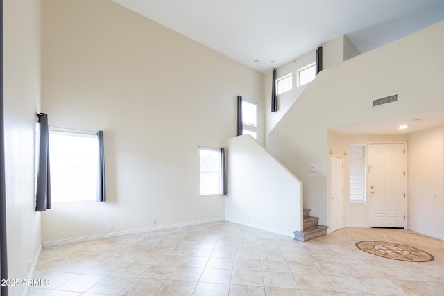 231 N Nash Way, Chandler, AZ 85225 - interior space with light tile patterned floors, stairway, a towering ceiling, and visible vents