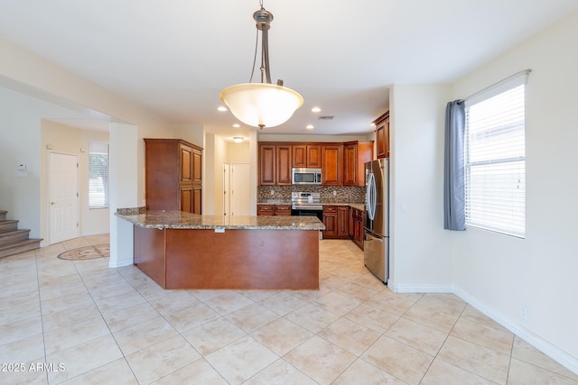 231 N Nash Way, Chandler, AZ 85225 - kitchen featuring a peninsula, stone counters, appliances with stainless steel finishes, tasteful backsplash, and light tile patterned flooring