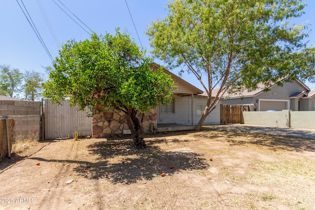 view of front of home with fence and a gate