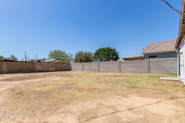 view of yard featuring a fenced backyard