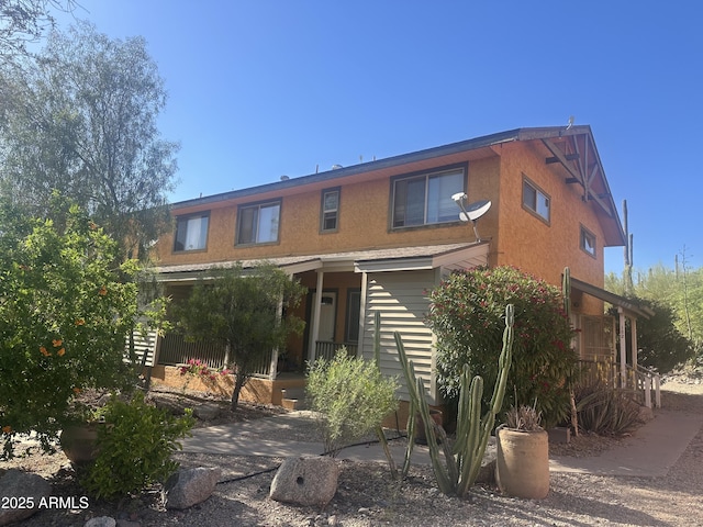 6448 E Paso Nuevo Dr Unit 101, Cave Creek, AZ 85331 - rear view of house with stucco siding