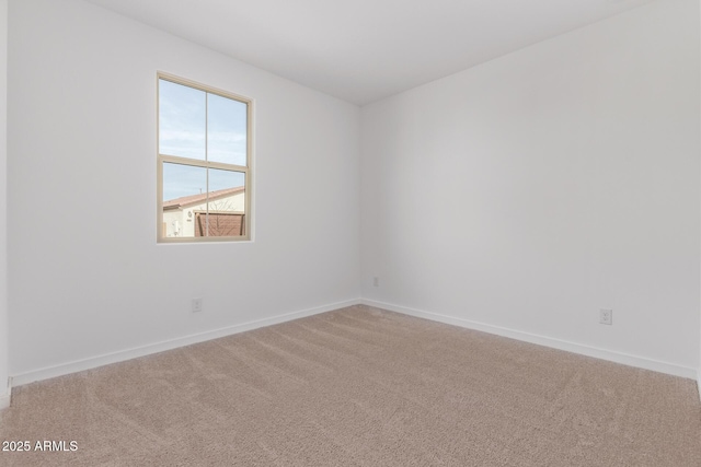 spare room featuring carpet floors