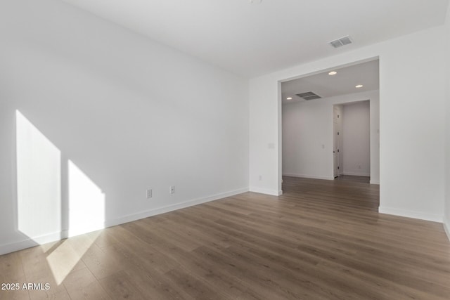 unfurnished room featuring wood-type flooring