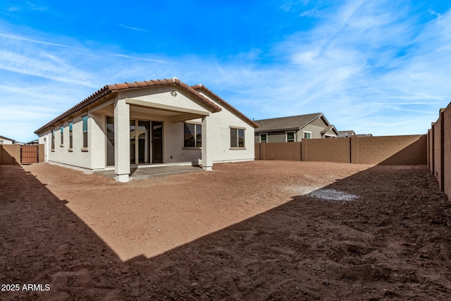 rear view of property featuring a patio area