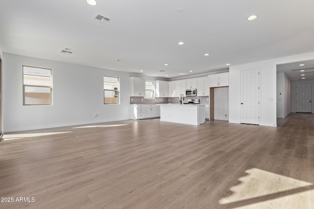 unfurnished living room featuring light wood-type flooring