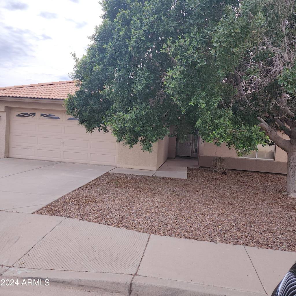 view of front of property with a garage