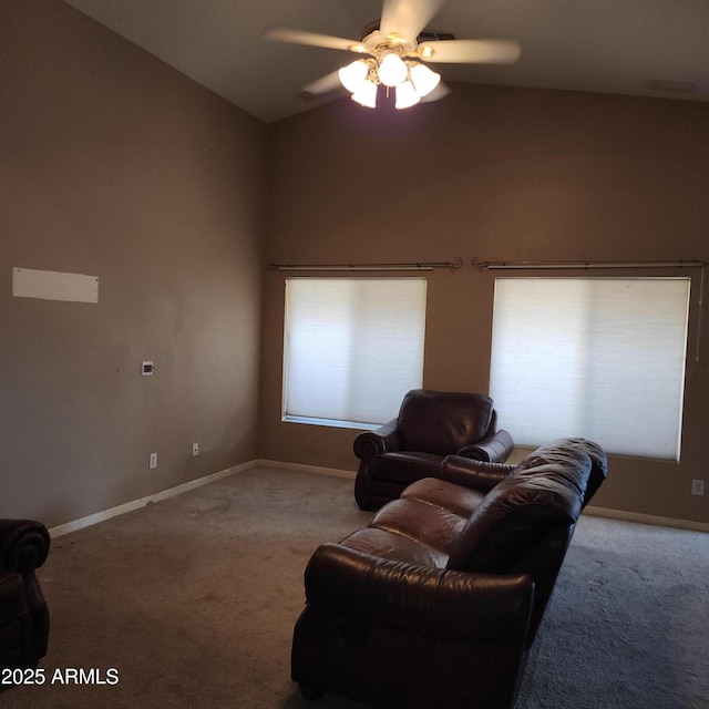 carpeted living room featuring ceiling fan, a healthy amount of sunlight, and vaulted ceiling