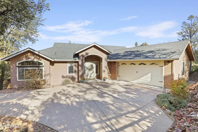 ranch-style house featuring a garage