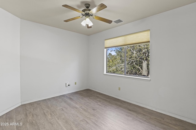 unfurnished room with ceiling fan and light hardwood / wood-style flooring