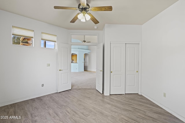 spare room featuring ceiling fan and light hardwood / wood-style floors