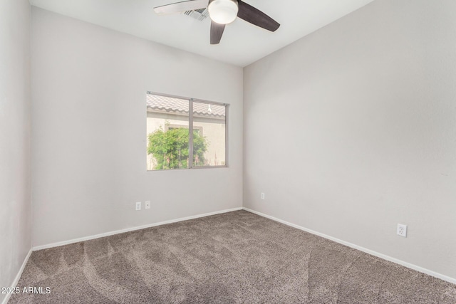 unfurnished room featuring a ceiling fan, carpet flooring, baseboards, and visible vents