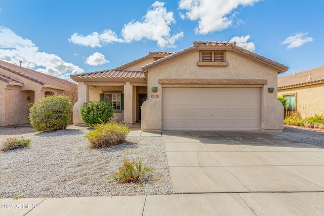 mediterranean / spanish-style house with stucco siding, an attached garage, driveway, and a tile roof