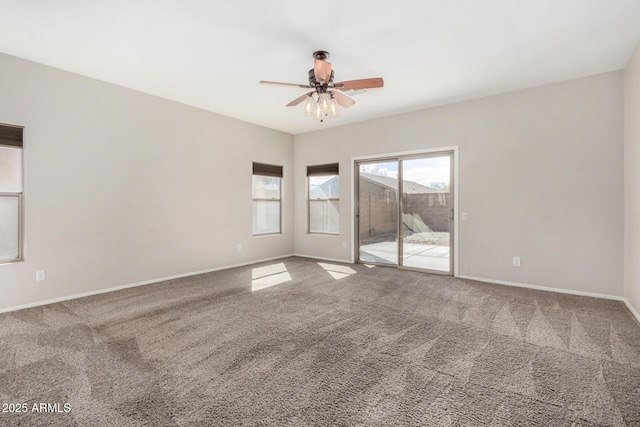 unfurnished room featuring baseboards, carpet floors, and ceiling fan