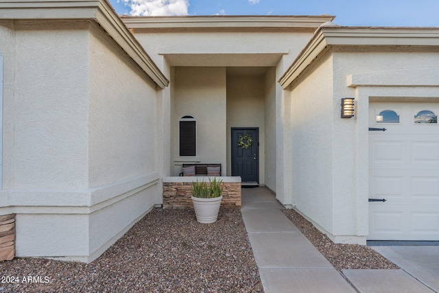 entrance to property featuring a garage