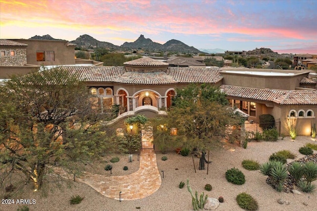 mediterranean / spanish-style home with a mountain view