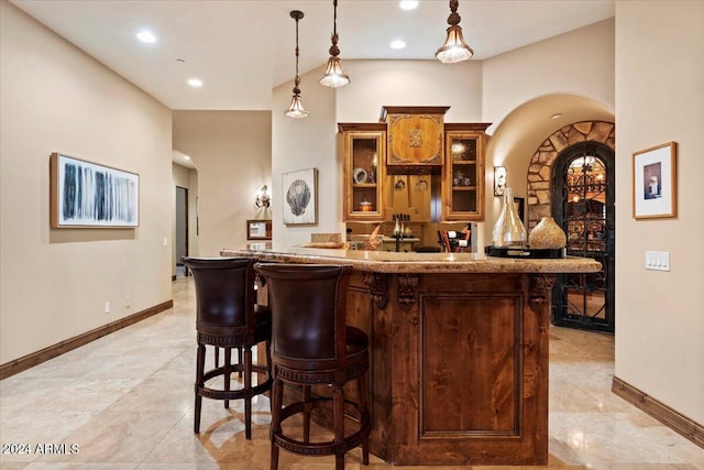 bar with hanging light fixtures