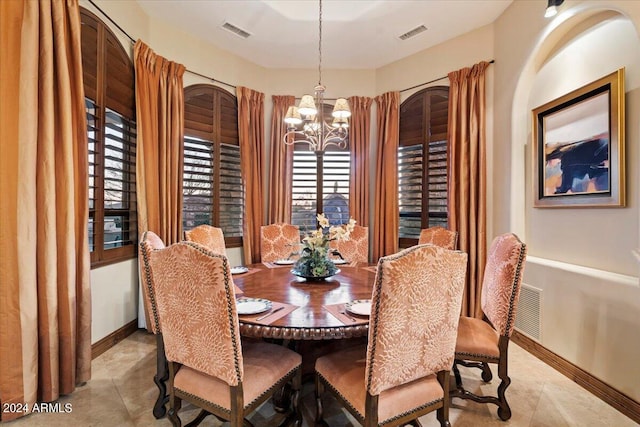 dining area featuring a chandelier