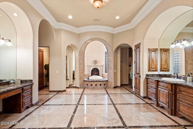 bathroom featuring crown molding, vanity, and a bathing tub