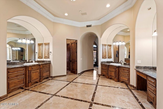 bathroom featuring ornamental molding and vanity