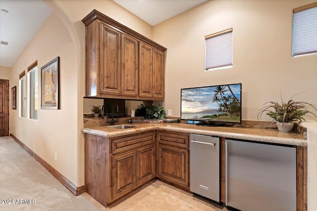 kitchen with sink and fridge