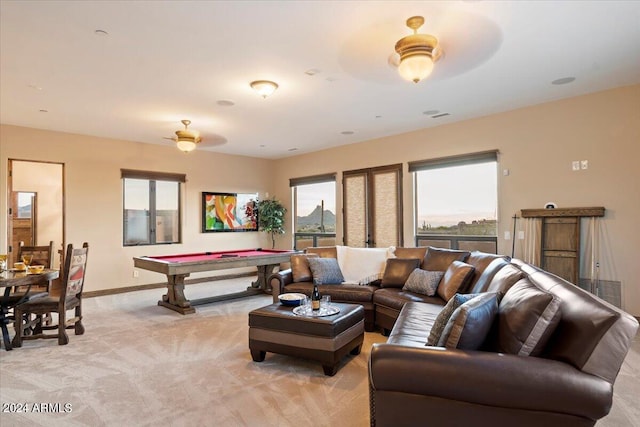 carpeted living room with ceiling fan and billiards