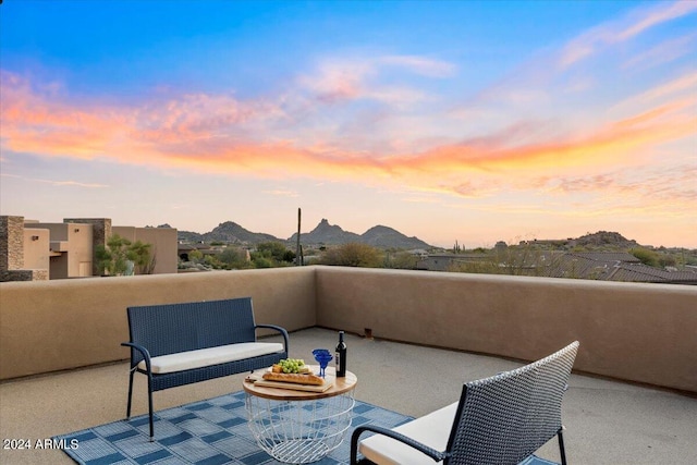 balcony at dusk with a mountain view