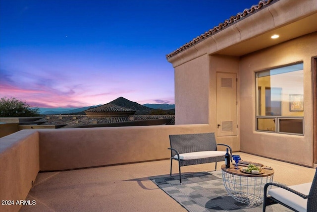 view of balcony at dusk