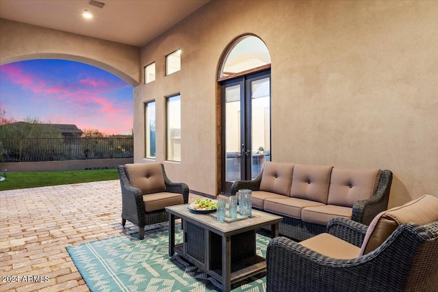 patio terrace at dusk with an outdoor living space