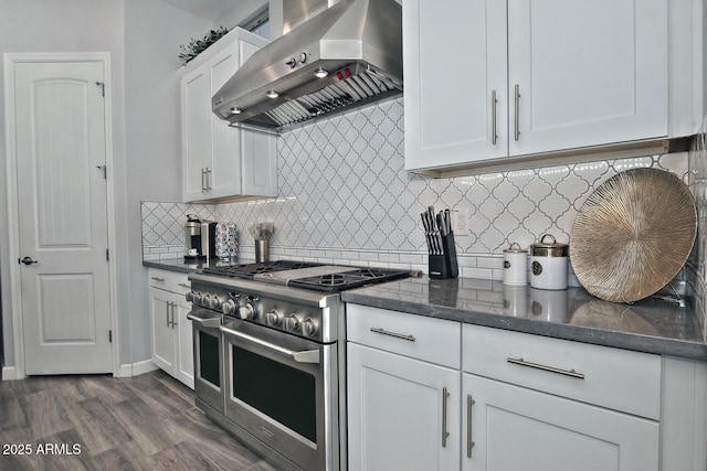 895 E Clovefield St, Gilbert, AZ 85298 - kitchen with tasteful backsplash, wall chimney range hood, double oven range, white cabinetry, and dark wood-type flooring