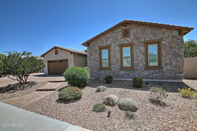 895 E Clovefield St, Gilbert, AZ 85298 - view of front of property with stucco siding, an outdoor structure, a tile roof, an attached garage, and driveway