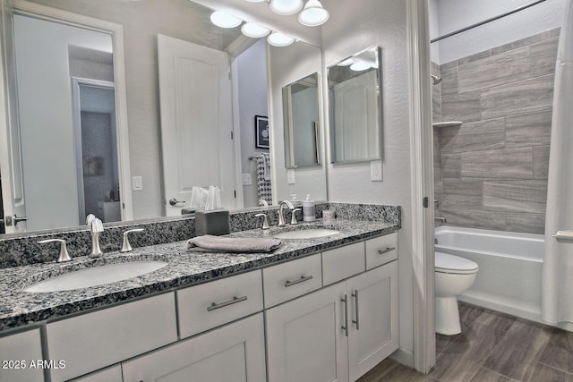 895 E Clovefield St, Gilbert, AZ 85298 - bathroom featuring double vanity, a sink, toilet, and wood finished floors