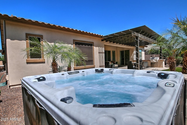 895 E Clovefield St, Gilbert, AZ 85298 - exterior space with a hot tub, washer / dryer, and stucco siding