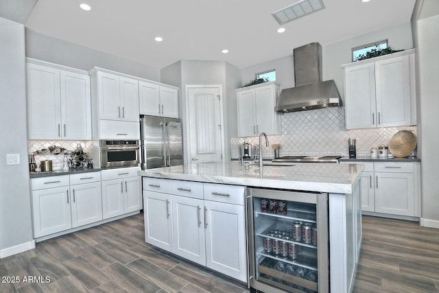 895 E Clovefield St, Gilbert, AZ 85298 - kitchen featuring visible vents, wall chimney exhaust hood, appliances with stainless steel finishes, wine cooler, and white cabinetry