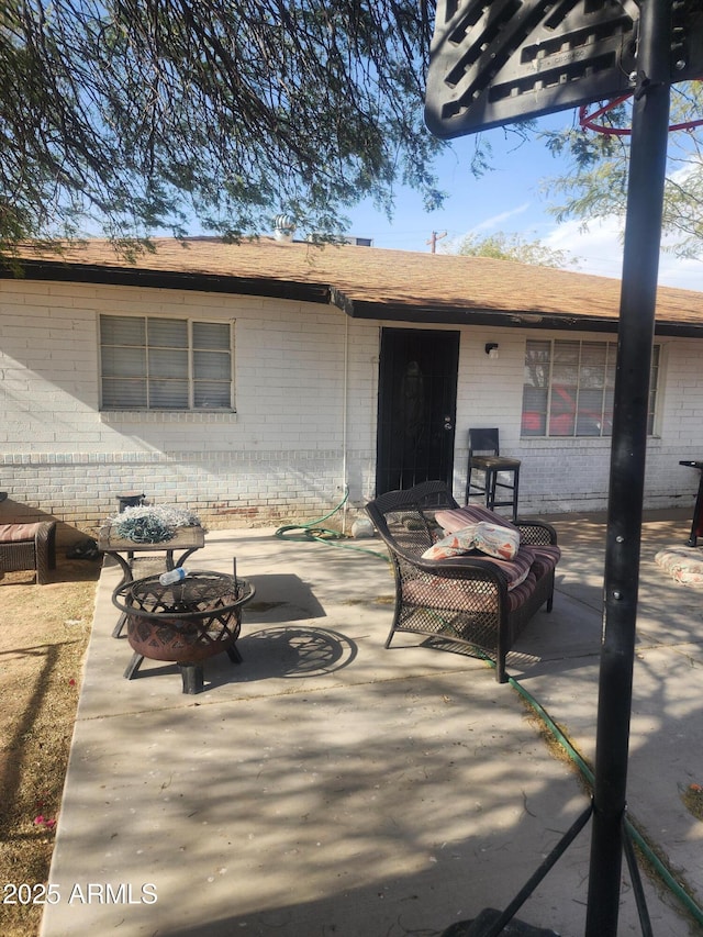 view of patio featuring a fire pit