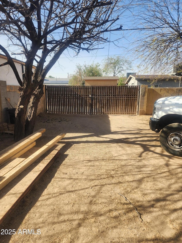 exterior space featuring a gate and fence